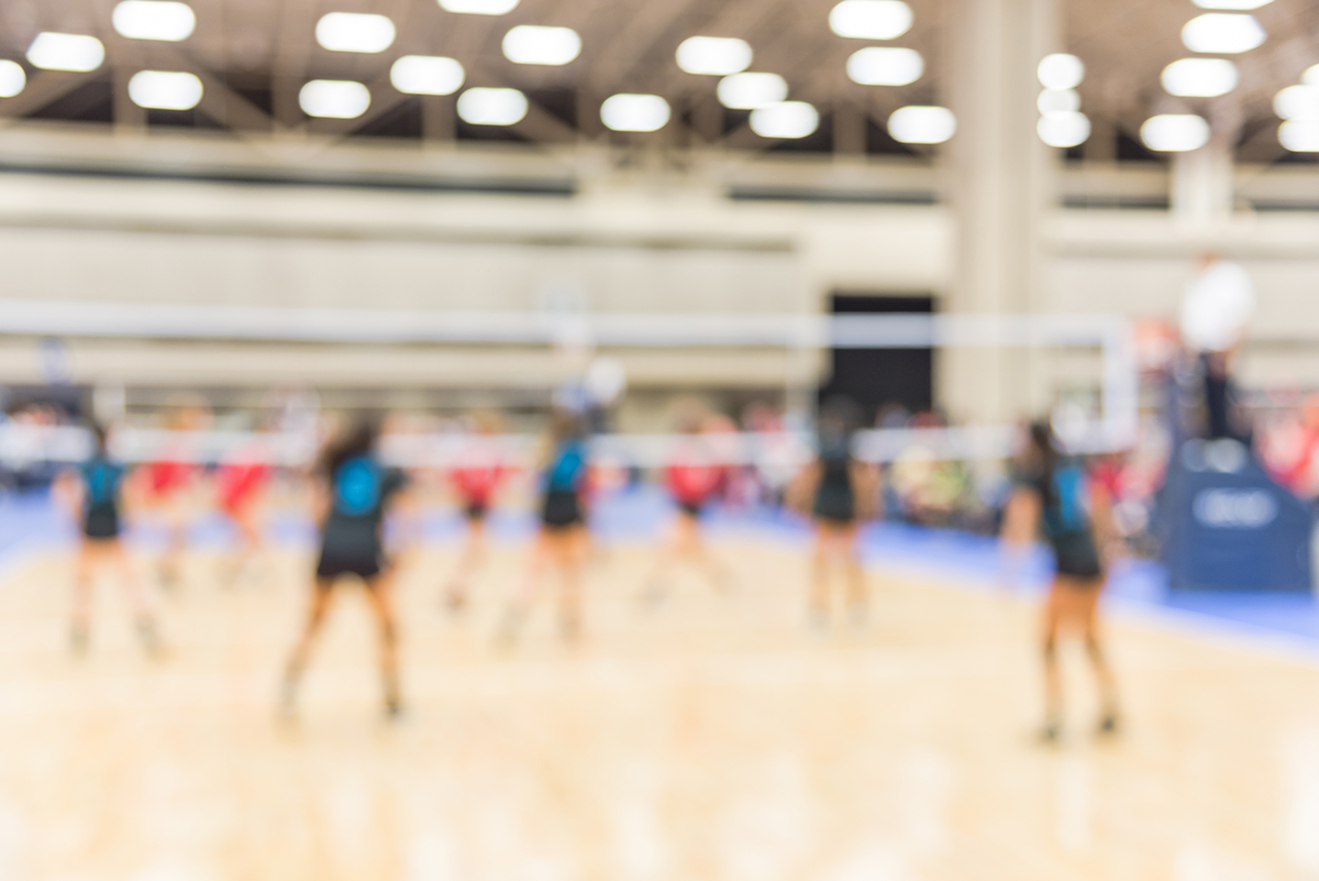 blurred volleyball team at a tournament