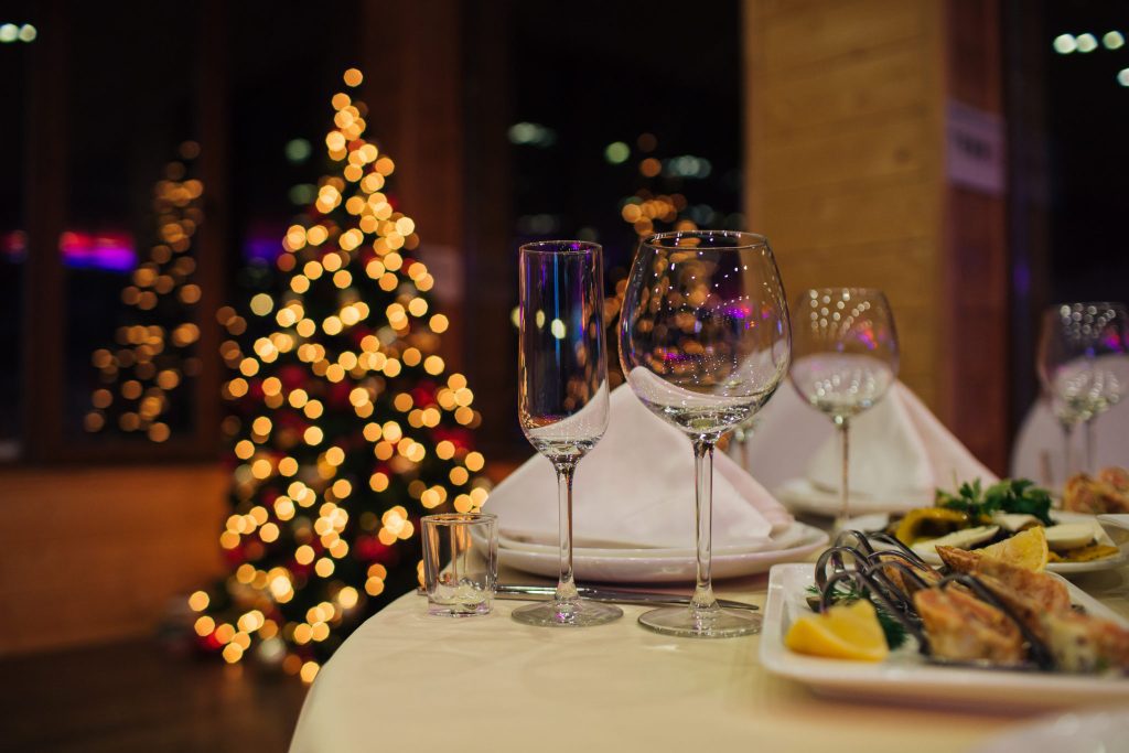 A formal dining setting at a corporate holiday party.
