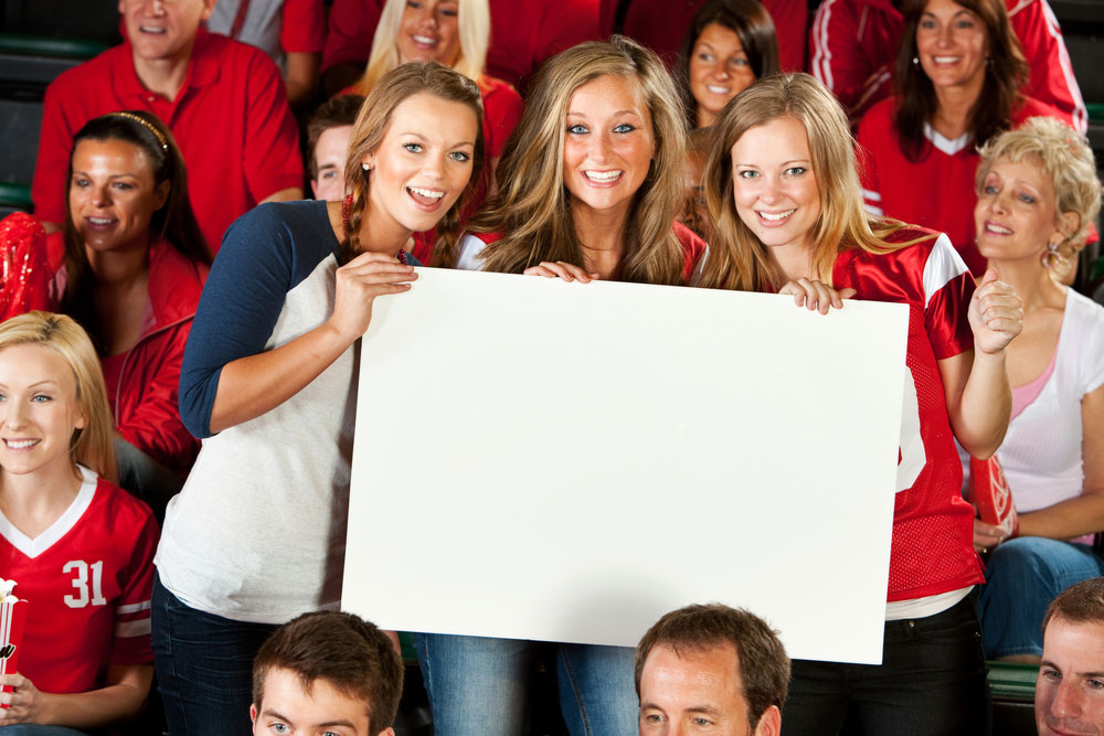 Group of girls holding blank sign