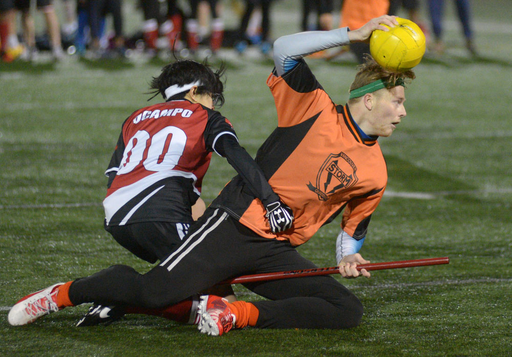Quidditch players in action - scoring a goal