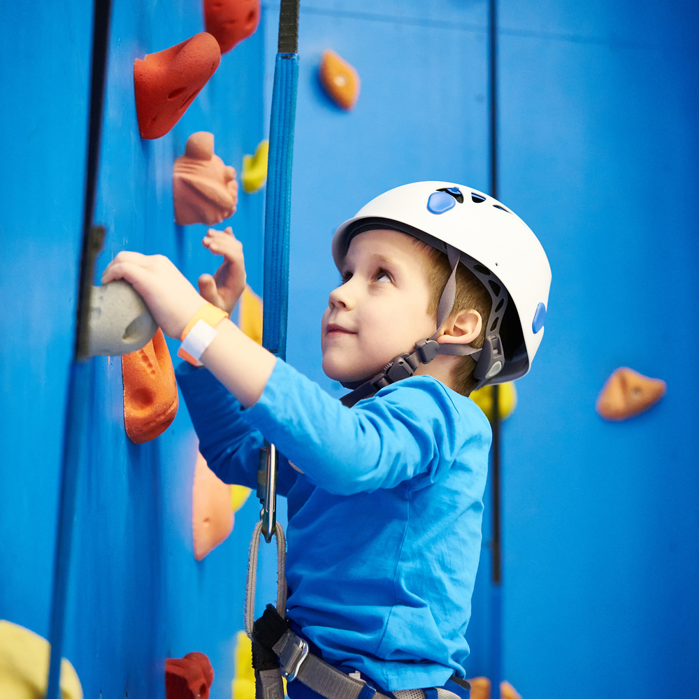 Little Boy climbing with Clip N’ Climb