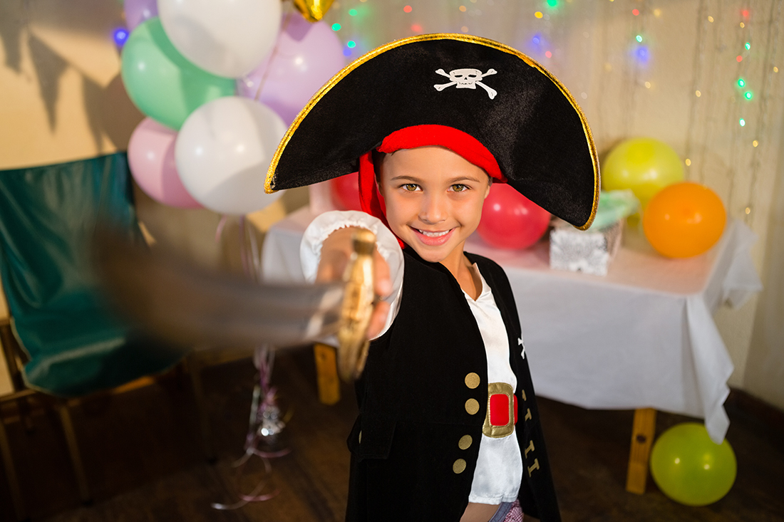 Boy dressed as a pirate for his birthday party