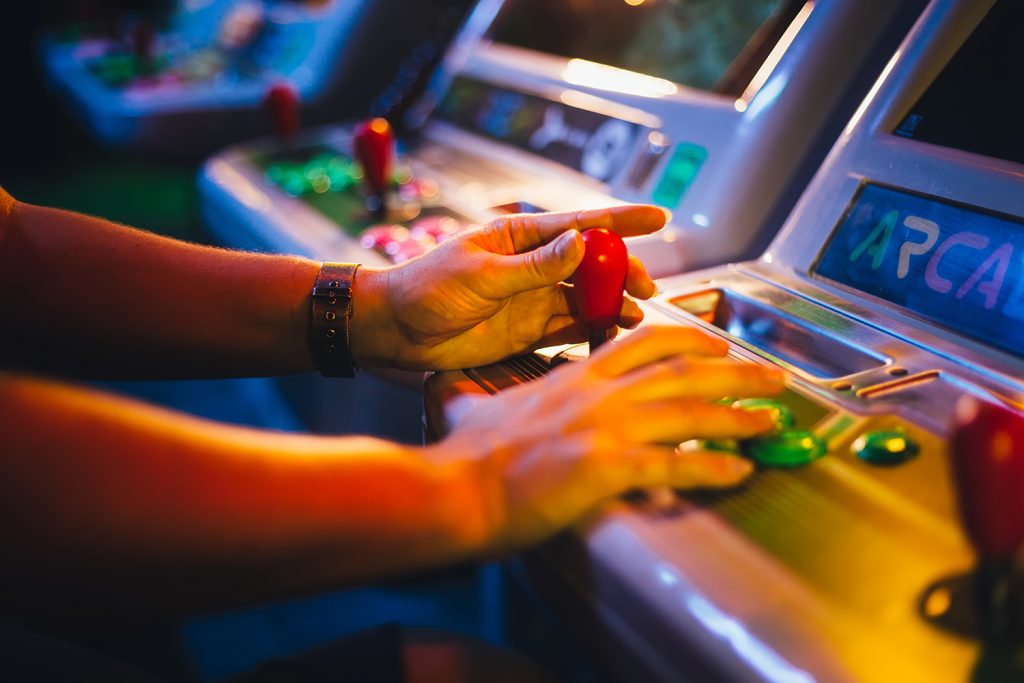 Person playing an arcade game