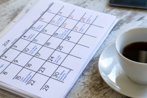 Calendar sitting on wooden table