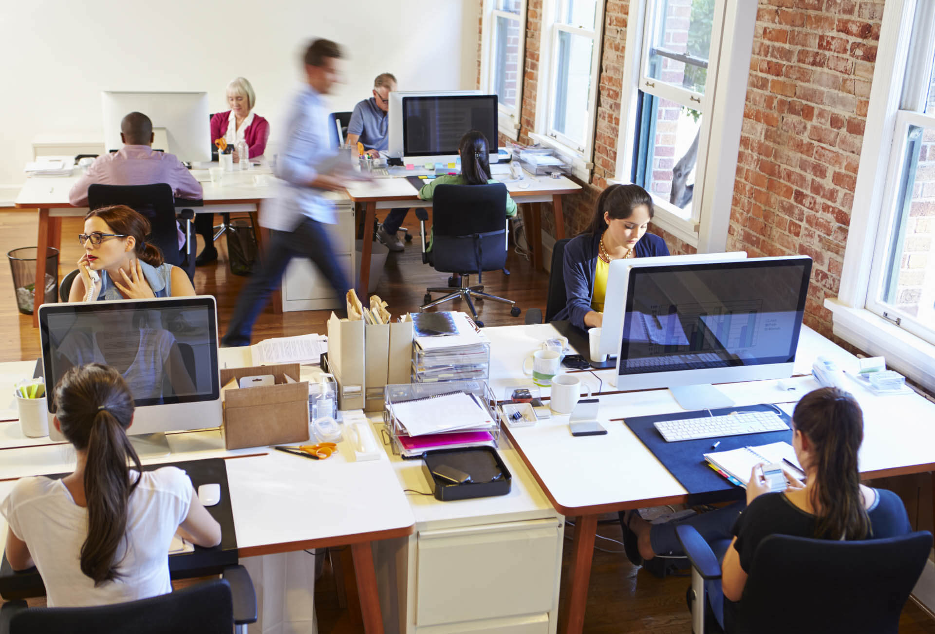 office full of workers on computers