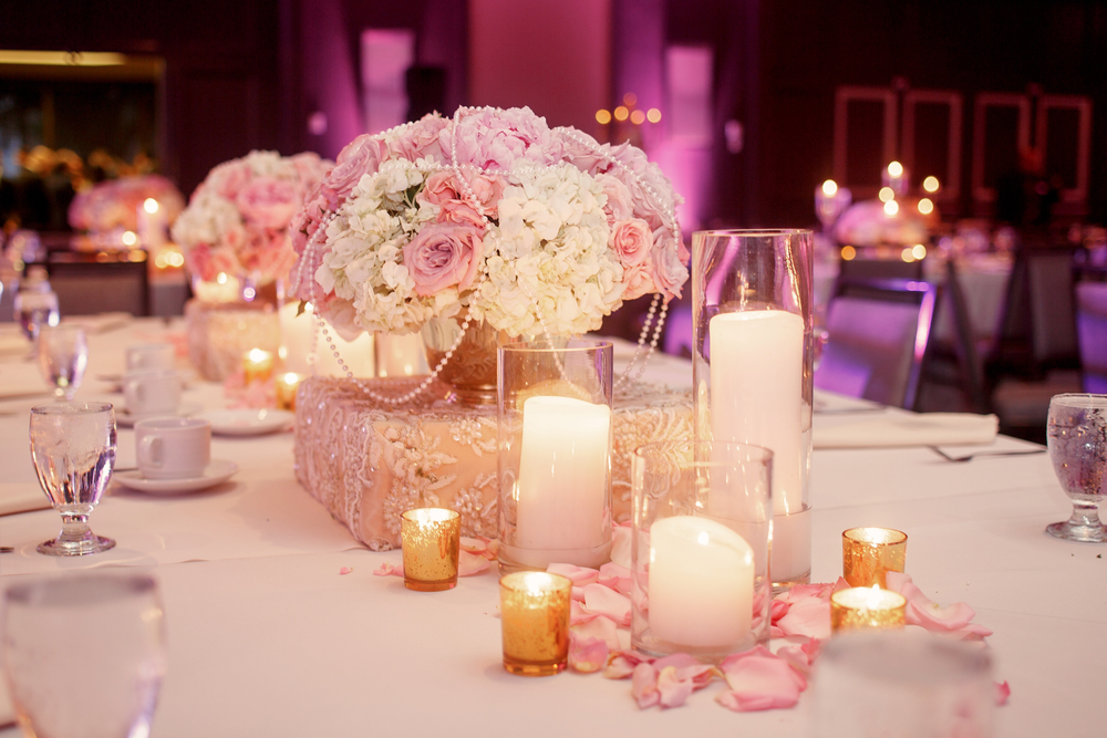 Lighted candles and flowers at a wedding venue